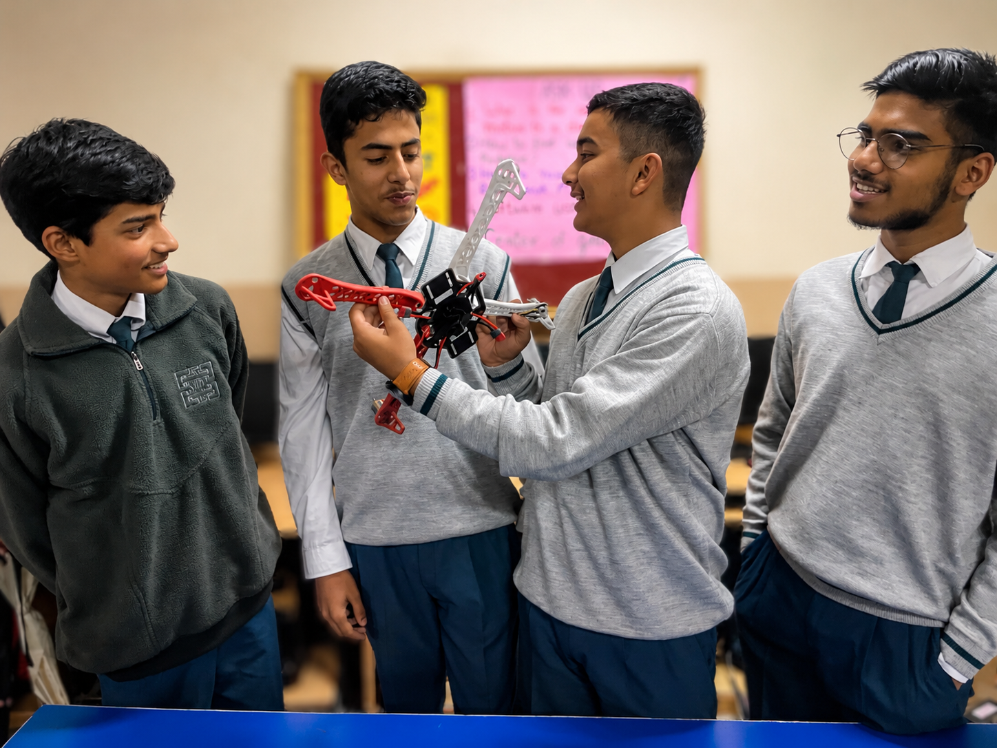 Students discussing a drone build in class