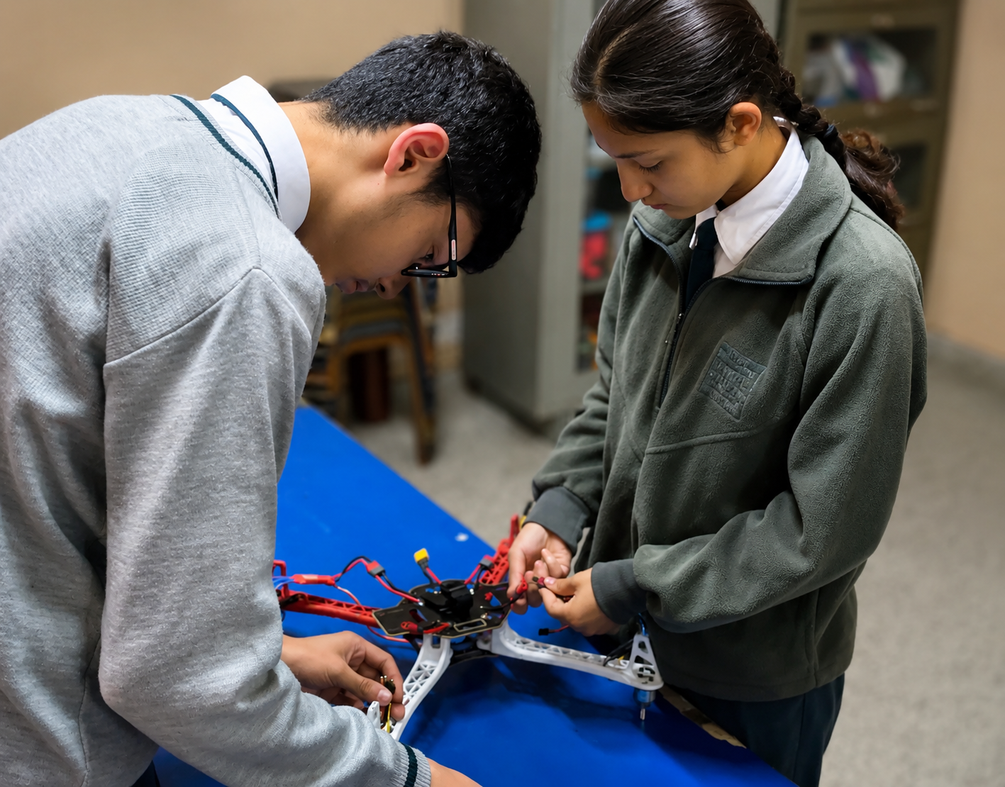 Students assembling a drone arm and motor