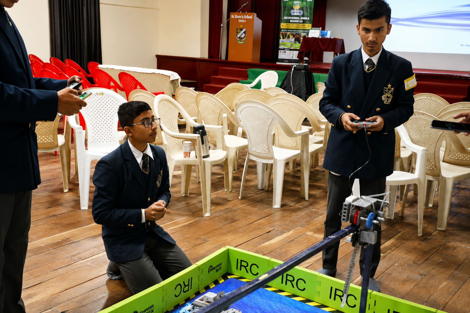 Students testing a robotics project at an event